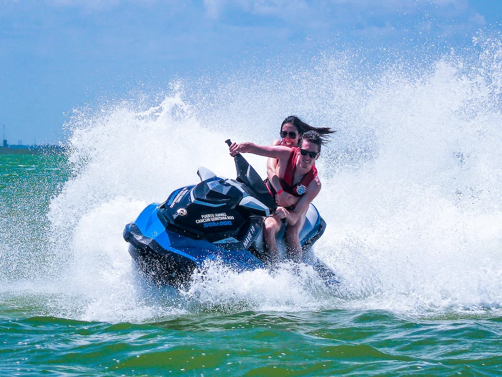 A couple driving a Jetski